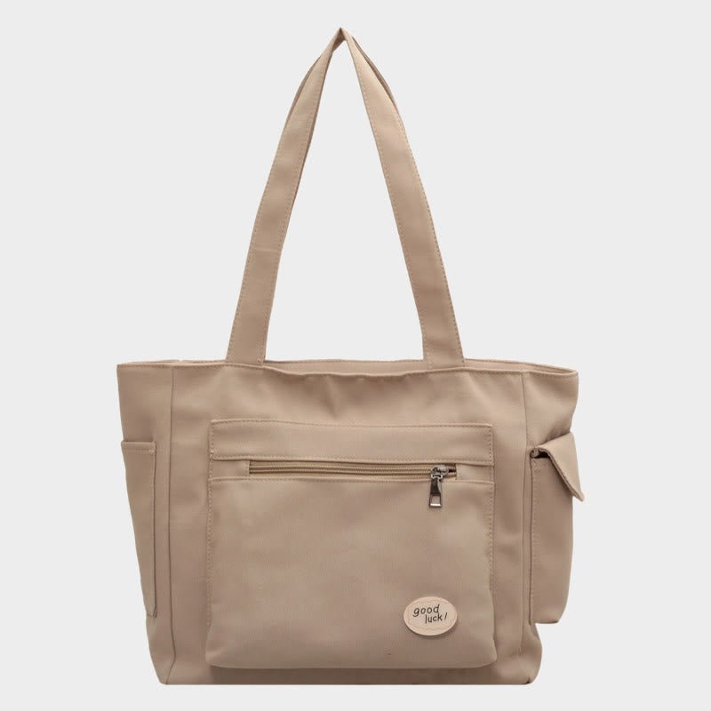 Tan canvas tote bag for women with zipper and pockets