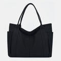 Black canvas tote bag with canvas handles and zipper closure