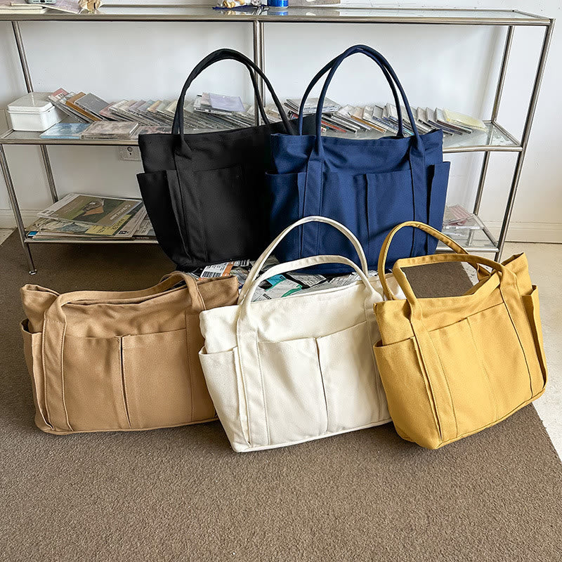 Black, navy blue, beige, white, and yellow large canvas tote color options