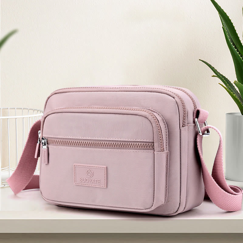 Lilac four-zip lightweight nylon crossbody bag for women