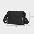 Black waterproof nylon crossbody bag dimensions 26 by 10 by 19 centimeters
