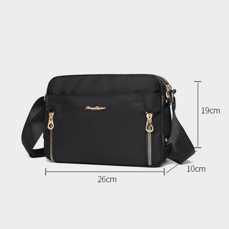 Black waterproof nylon crossbody bag dimensions 26 by 10 by 19 centimeters