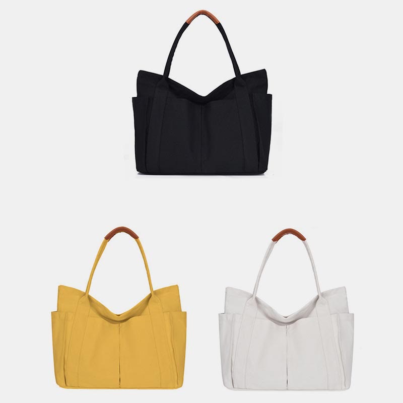 Black, yellow, and white large canvas tote color options