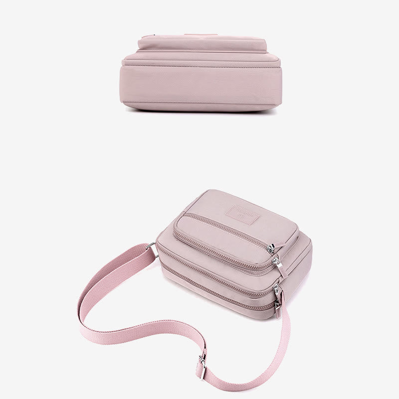 Light pink four-zip crossbody bag shown from top and bottom angles