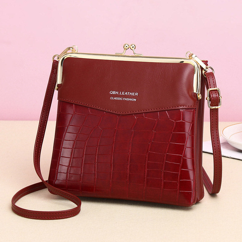 Women's kiss lock crossbody bag with double compartments