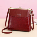 Women's kiss lock crossbody bag with double compartments