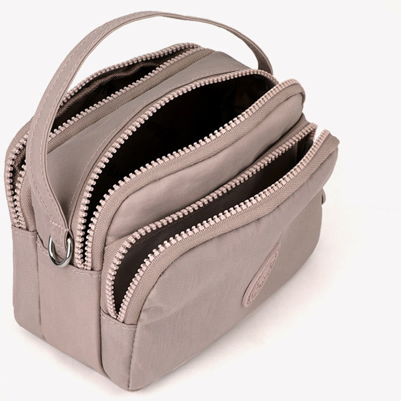 Women's small nylon triple compartment crossbody bag