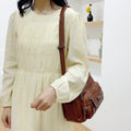 Women's leather bag with multiple pockets
