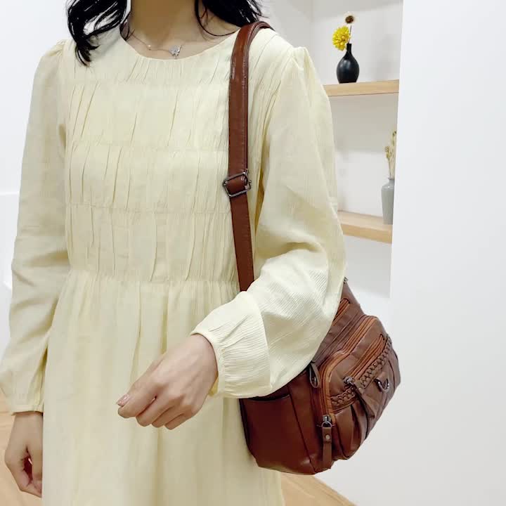 Women's leather bag with multiple pockets