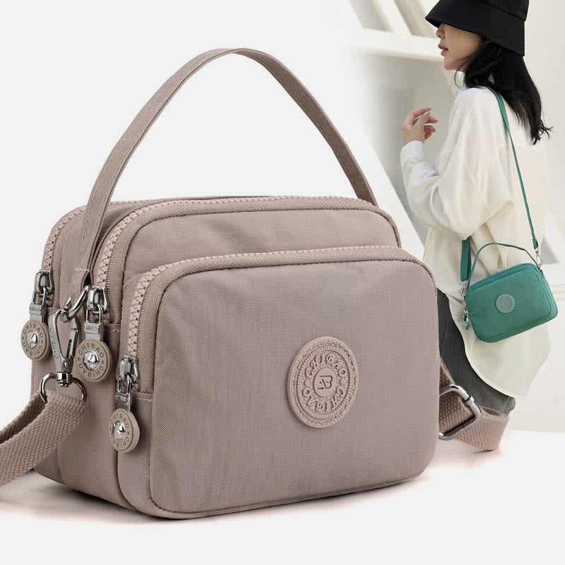 Women's small nylon triple compartment crossbody bag