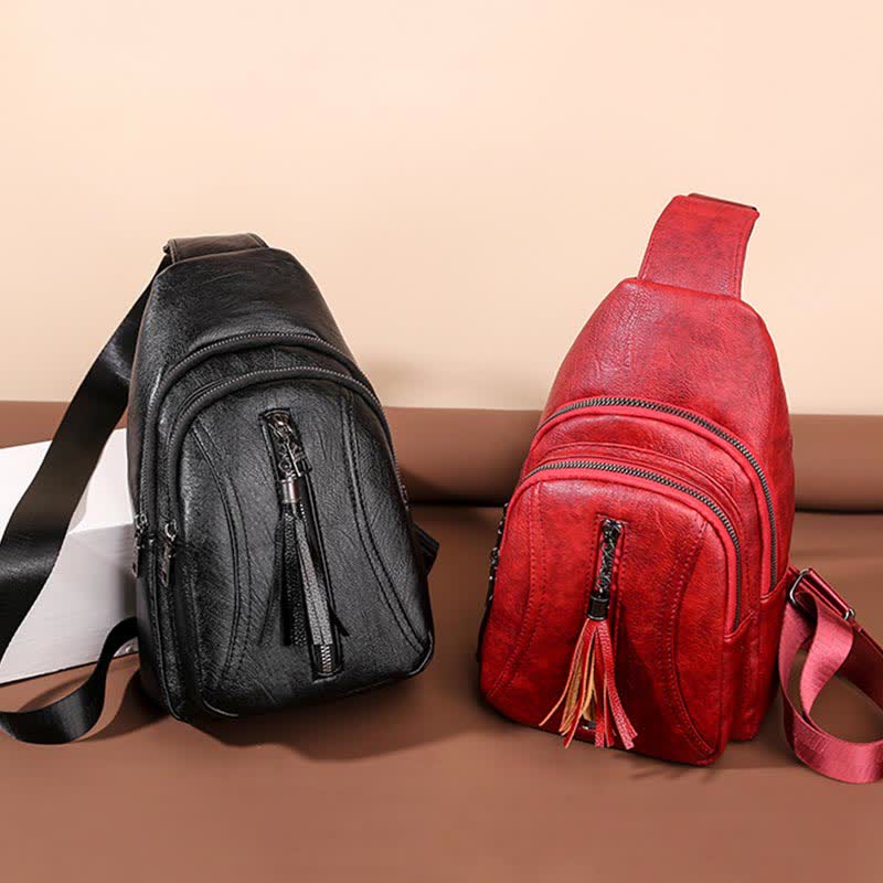 Black and red PU leather sling bags side by side