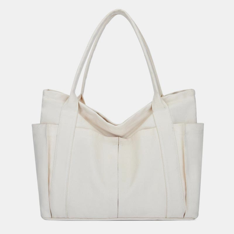 White canvas tote bag with canvas handles and zipper closure