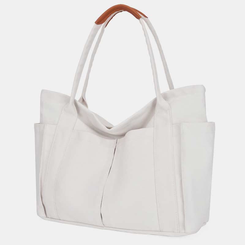 White canvas tote bag with PU leather handles and zipper closure
