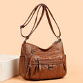 Women's leather bag with multiple pockets