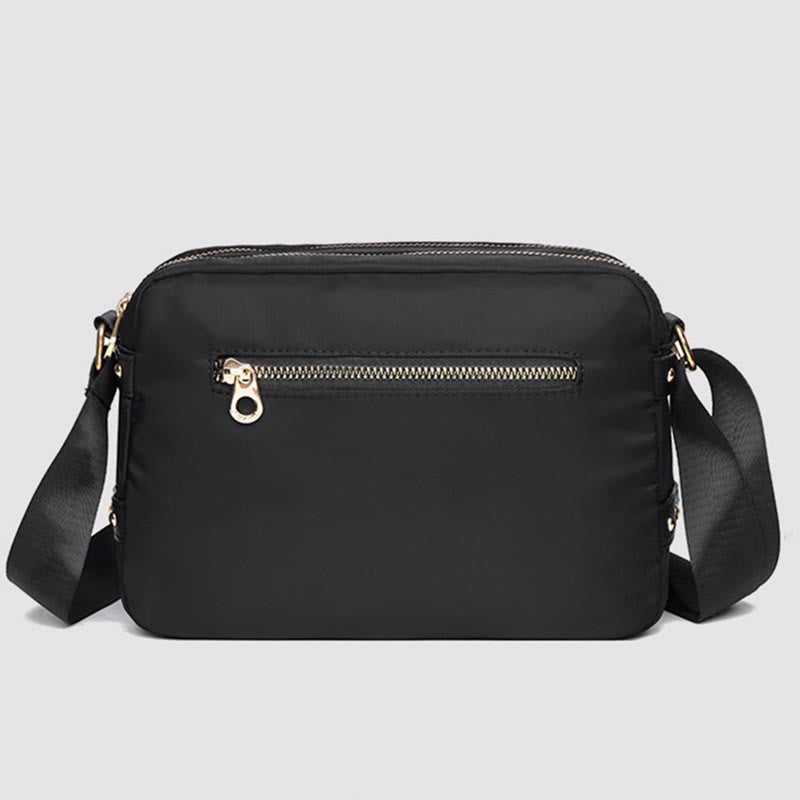 Black waterproof nylon crossbody bag back zipper pocket
