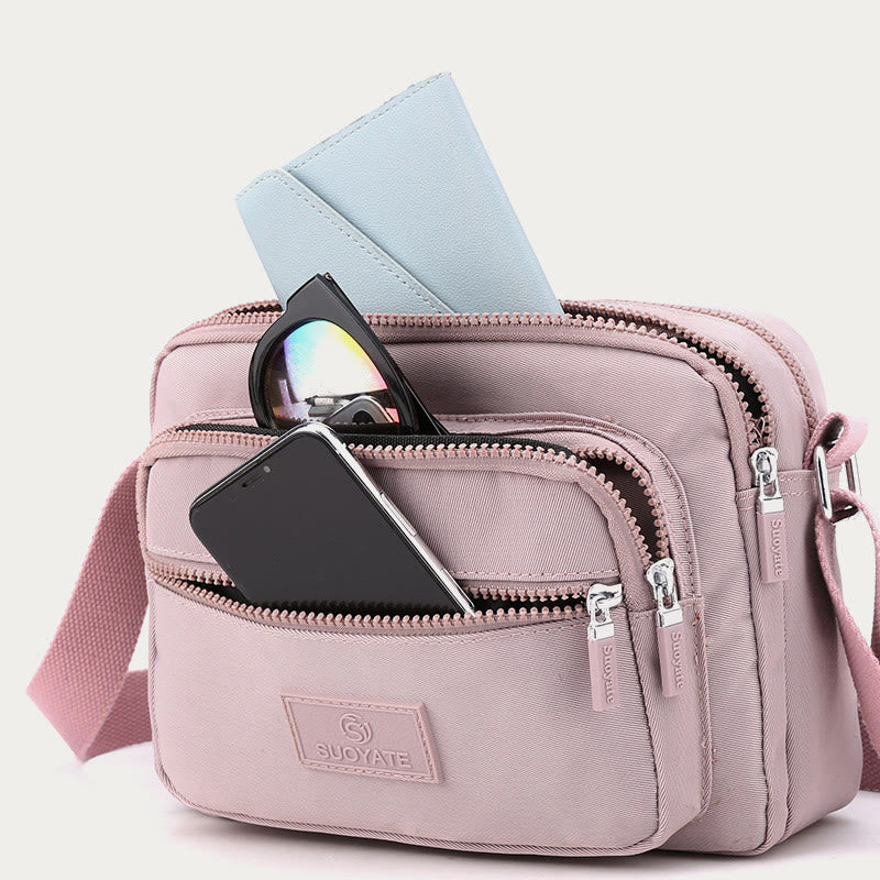 Lilac four-zip lightweight nylon crossbody bag for women