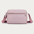 Light pink four-zip crossbody bag back view