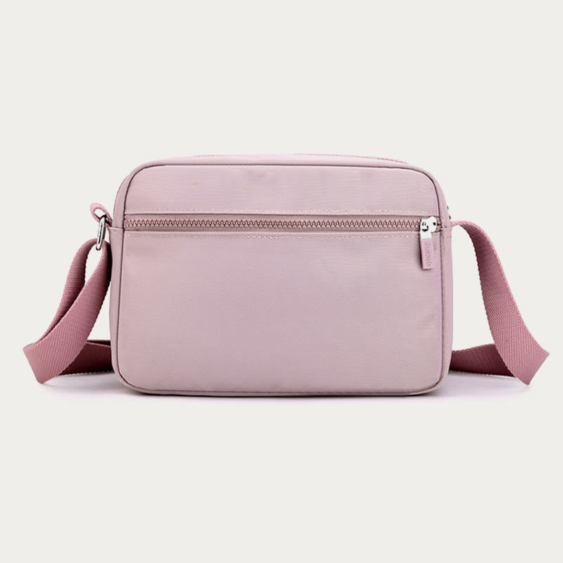 Light pink four-zip crossbody bag back view