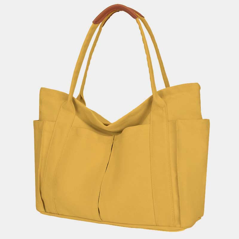 Yellow canvas tote bag with PU leather handles and zipper closure