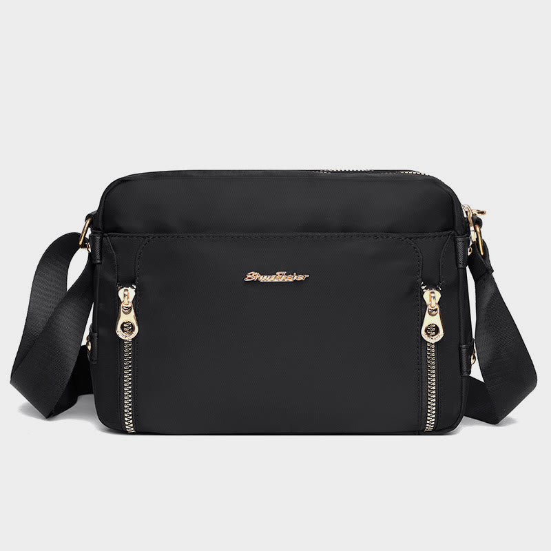 Black waterproof nylon crossbody bag for women with adjustable strap