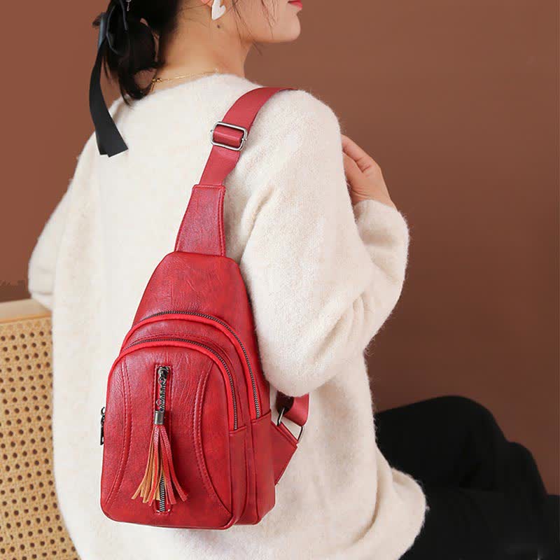 Red PU leather sling bag worn over the shoulder