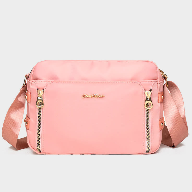 Light pink waterproof nylon crossbody bag for women with adjustable strap